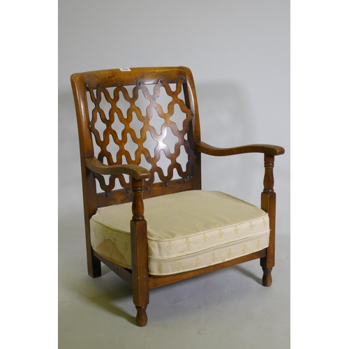 1080 - A small 1930s beechwood nursing / bedroom chair, with trellis back, 70cm high