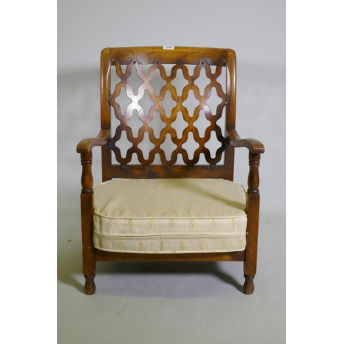 1080 - A small 1930s beechwood nursing / bedroom chair, with trellis back, 70cm high