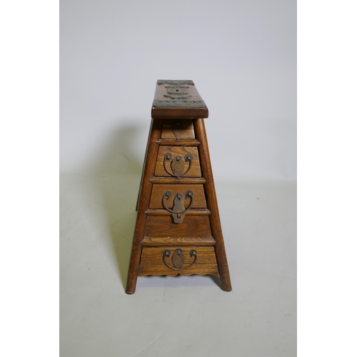 1084 - A C19th Chinese elm barber's stool with decorative bronze mounts and four end drawers, 43 x 26cm, 45... 