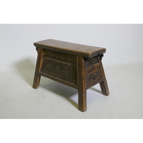 1085 - A C19th Chinese elm barber's stool with two end drawers, 42 x 23cm, 28cm high