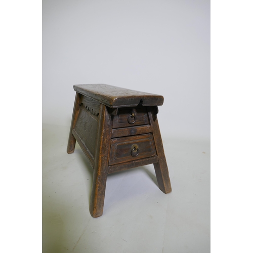 1085 - A C19th Chinese elm barber's stool with two end drawers, 42 x 23cm, 28cm high