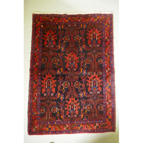 1087 - A Persian Hamadan red ground wool rug with unique geometric design, 148 x 104cm