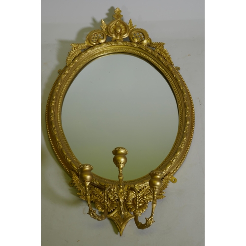 1088 - A pair of Victorian giltwood and composition three branch girondelle wall mirrors, 96cm long