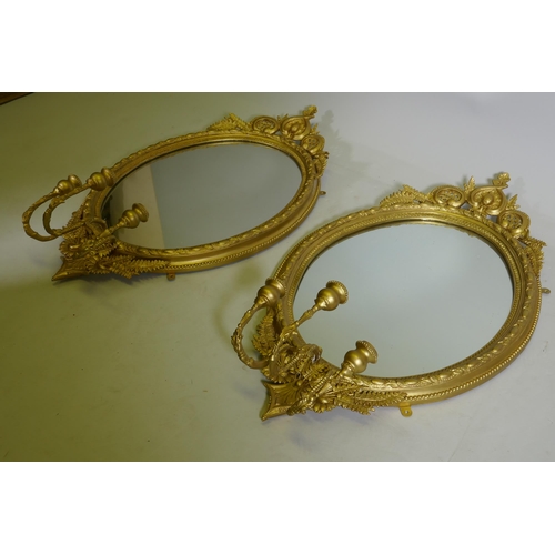 1088 - A pair of Victorian giltwood and composition three branch girondelle wall mirrors, 96cm long