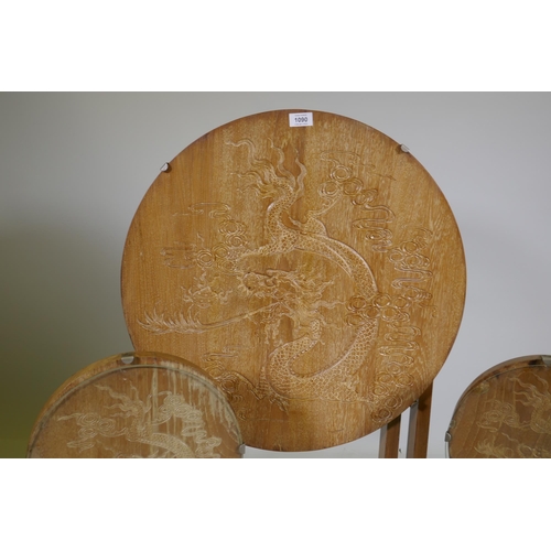 1090 - A set of three Art Deco limed oak occasional tables with carved Chinese dragon decoration, largest 6... 