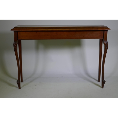 1091 - A mahogany hall table, raised on carved shaped supports, 112 x 27 x 77cm