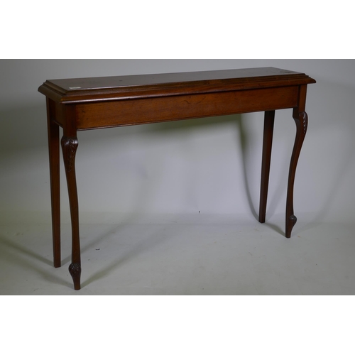 1091 - A mahogany hall table, raised on carved shaped supports, 112 x 27 x 77cm