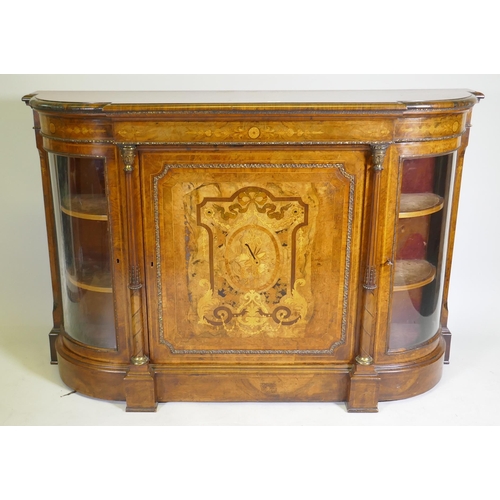 1096 - A Victorian inlaid burr walnut credenza with brass mounts, two bow end glazed doors and central marq... 