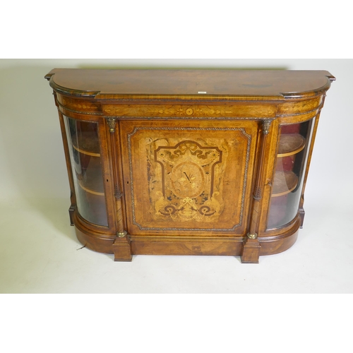 1096 - A Victorian inlaid burr walnut credenza with brass mounts, two bow end glazed doors and central marq... 