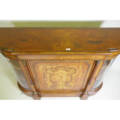 1096 - A Victorian inlaid burr walnut credenza with brass mounts, two bow end glazed doors and central marq... 