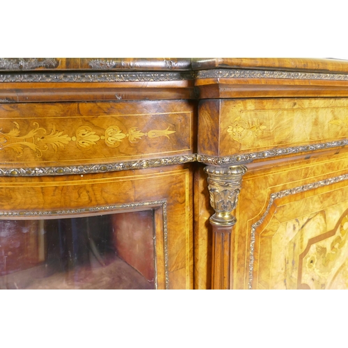 1096 - A Victorian inlaid burr walnut credenza with brass mounts, two bow end glazed doors and central marq... 