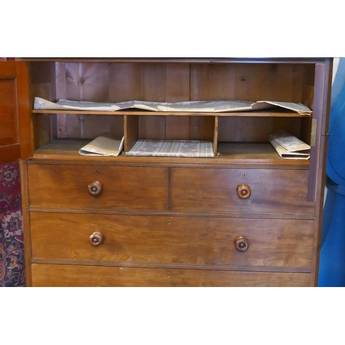 1098 - A Victorian mahogany press cupboard with two doors over two over three drawers, fitted with Hobb's l... 