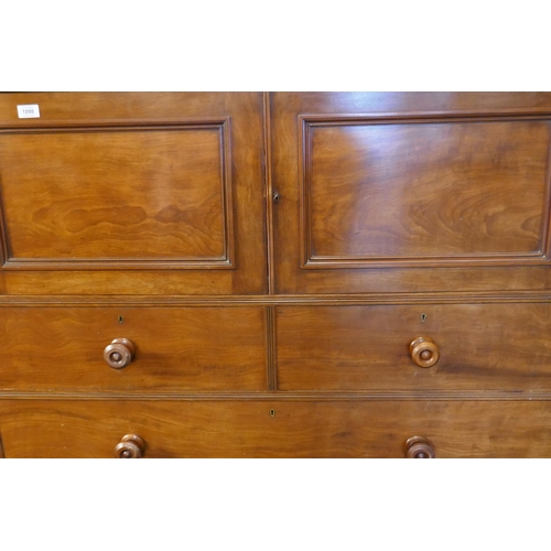 1098 - A Victorian mahogany press cupboard with two doors over two over three drawers, fitted with Hobb's l... 