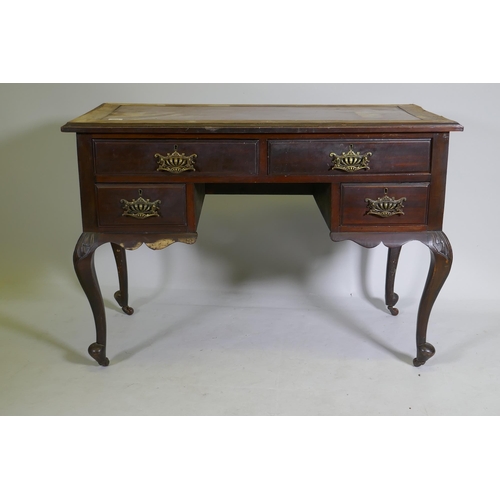 1099 - A Victorian mahogany four drawer kneehole desk, raised on carved cabriole supports, 110 x 52 x 76cm