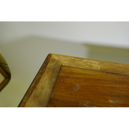 1099 - A Victorian mahogany four drawer kneehole desk, raised on carved cabriole supports, 110 x 52 x 76cm