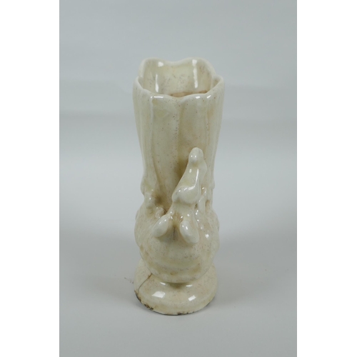 110 - A Chinese white glazed porcelain vase in the form of a phoenix, 18cm high, cracks to glaze