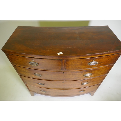 1103 - A George II mahogany bow front chest of two over three drawers, with brass plate handles, raised on ... 