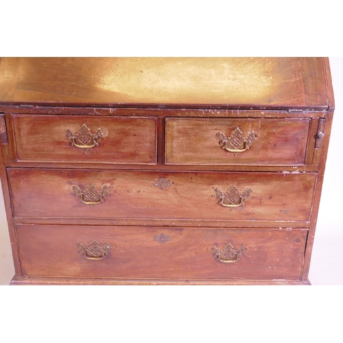 1105 - A George III mahogany fall front bureau, the interior with pigeon holes and drawers and secret drawe... 