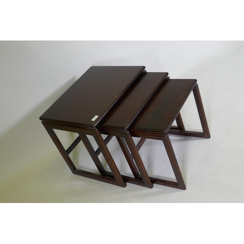 1106 - A nest of three mid century rosewood occasional tables, 55 x 44 x 48cm