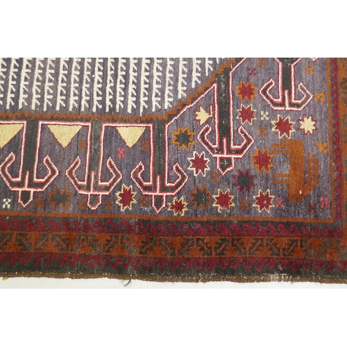 1108 - An oriental hand woven wool carpet, decorated with camels, deer and figures, 200 x 110cm