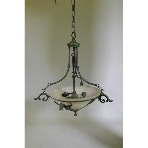 1111 - A pair of bronzed metal ceiling lamps with winged dragon decoration and etched glass shades, 65cm di... 