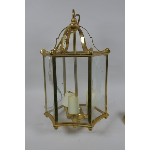 1113 - A brass ceiling lantern with concave glass panels, lantern 42cm high