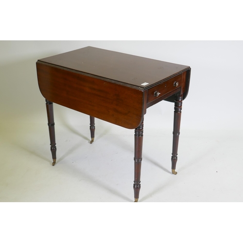 1115 - A Georgian mahogany pembroke table with single end drawer, raised on tapering ring turned supports w... 