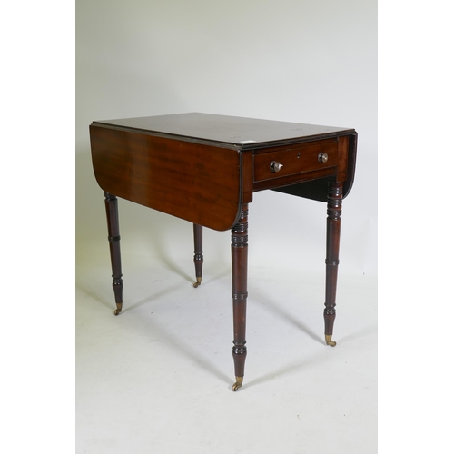 1115 - A Georgian mahogany pembroke table with single end drawer, raised on tapering ring turned supports w... 