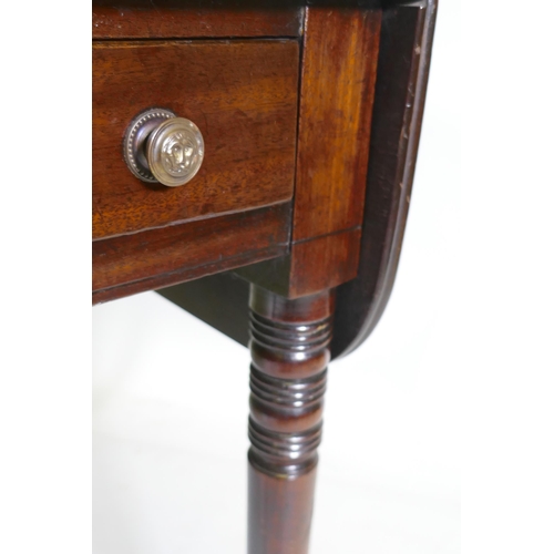 1115 - A Georgian mahogany pembroke table with single end drawer, raised on tapering ring turned supports w... 