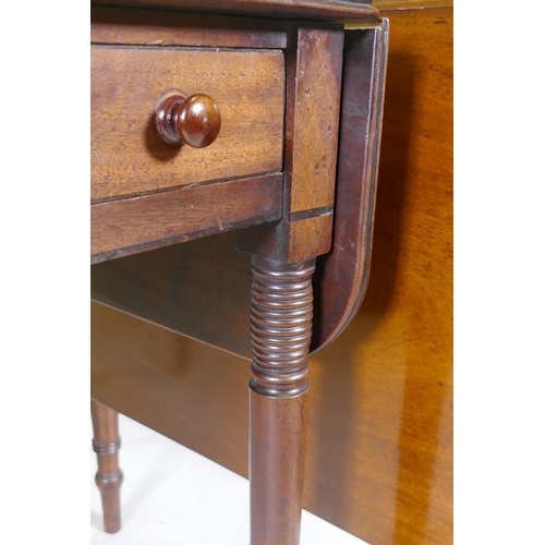 1116 - A Georgian mahogany pembroke table with single end drawer, raised on tapering supports with ring and... 