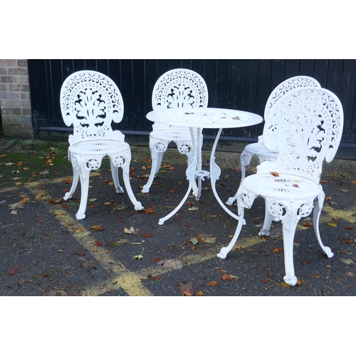 1123 - A painted aluminium Coalbrookdale style garden table and four chairs