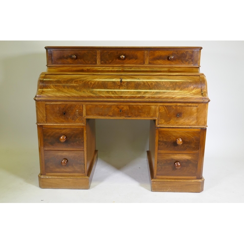 1130 - A C19th continental mahogany pedestal desk, the upper section with three drawers over a pull down fr... 