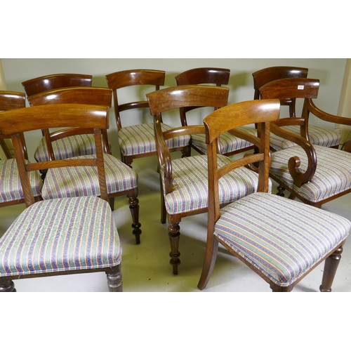 1131 - A set of eight (six plus two) Victorian mahogany bar back dining chairs raised on turned supports, a... 