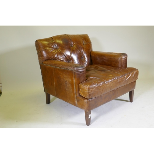 1132 - A Halo button back leather easy chair