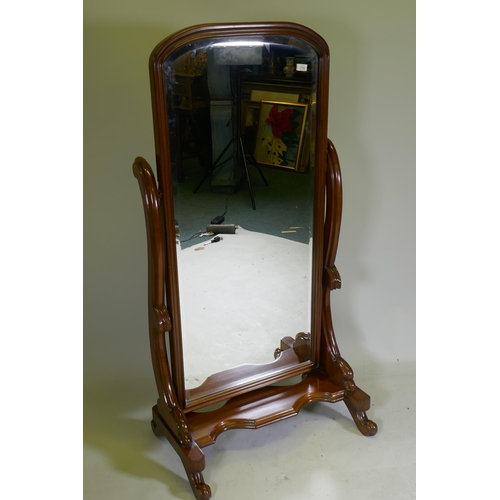 1133 - A Victorian style mahogany cheval mirror, with bevelled glass, 153cm high, 78cm wide