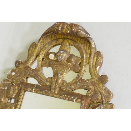 1140 - A C19th Italian gilt composition wall mirror with vine decoration, 92 x 48cm