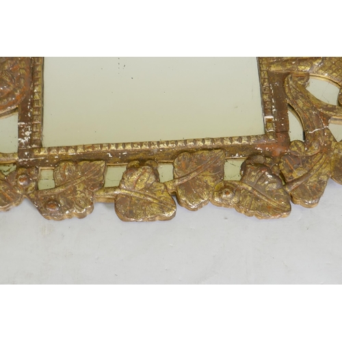 1140 - A C19th Italian gilt composition wall mirror with vine decoration, 92 x 48cm