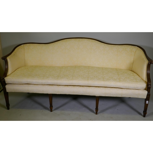 1144 - A Hepplewhite style humpback settee with scroll arms, raised on tapering supports, 200cm wide