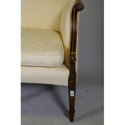 1144 - A Hepplewhite style humpback settee with scroll arms, raised on tapering supports, 200cm wide