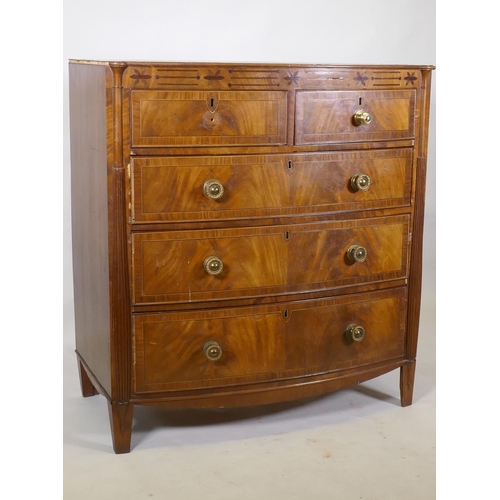 1148 - A Regency mahogany bowfront chest, with inlaid frieze and two over three drawers, flanked by reeded ... 