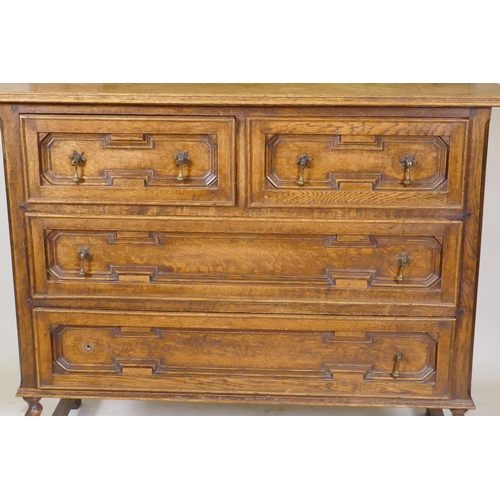 1153 - An early C20th oak Jacobean style dressing table, with swing mirror supported by barley twist column... 