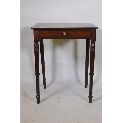 1157 - A Georgian mahogany single drawer side table, raised on ring turned tapering supports