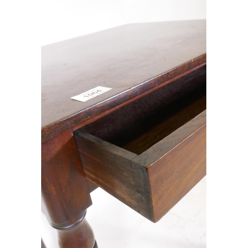 1157 - A Georgian mahogany single drawer side table, raised on ring turned tapering supports