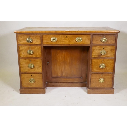 1165 - C19th faded mahogany nine drawer knee hole desk, the cupboard with two shelves, brass plate handles ... 