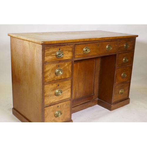 1165 - C19th faded mahogany nine drawer knee hole desk, the cupboard with two shelves, brass plate handles ... 