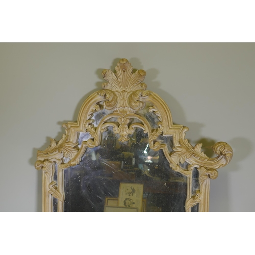 1166 - A carved and painted wall mirror, AF losses, 136cm high