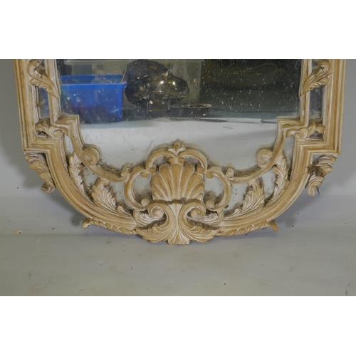 1166 - A carved and painted wall mirror, AF losses, 136cm high