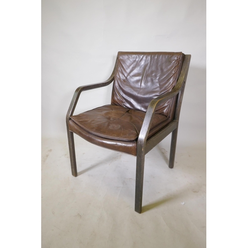 1168 - A laminated open elbow chair with brown leather seat pad and back