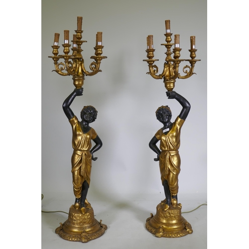 121 - A pair of composition blackamoor five branch torcheres, 126cm high