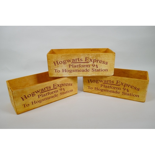 130 - A set of three Harry Potter 'Hogwarts Express' wooden condiment trays, 28 x 12cm